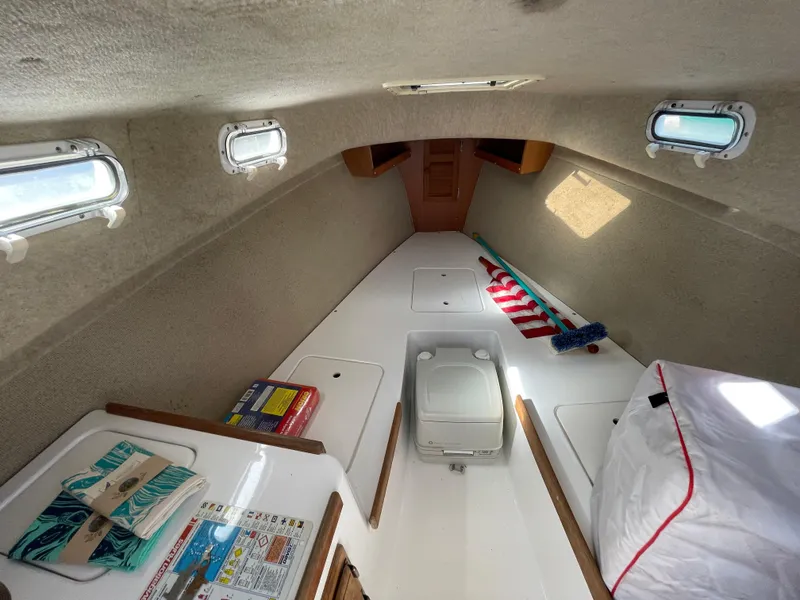 Slide: The Image of Interior of 2003 Atlas Boat Works Pompano 21, featuring compact cabin space and amenities. - 40