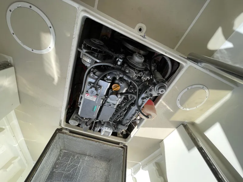 Slide: The Image of Engine compartment of a 2003 Atlas Boat Works Pompano 21, showcasing internal components. - 45