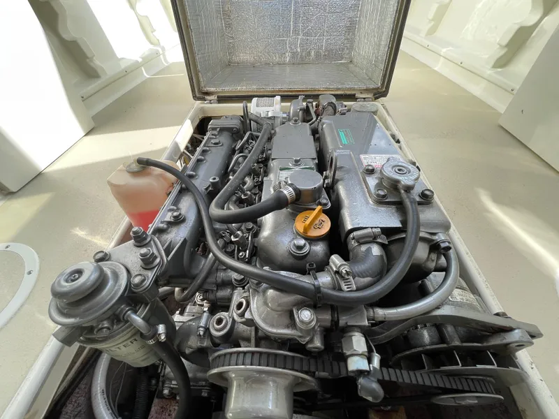 Slide: The Image of Engine compartment of a 2003 Atlas Boat Works Pompano 21, showcasing detailed mechanical components. - 46