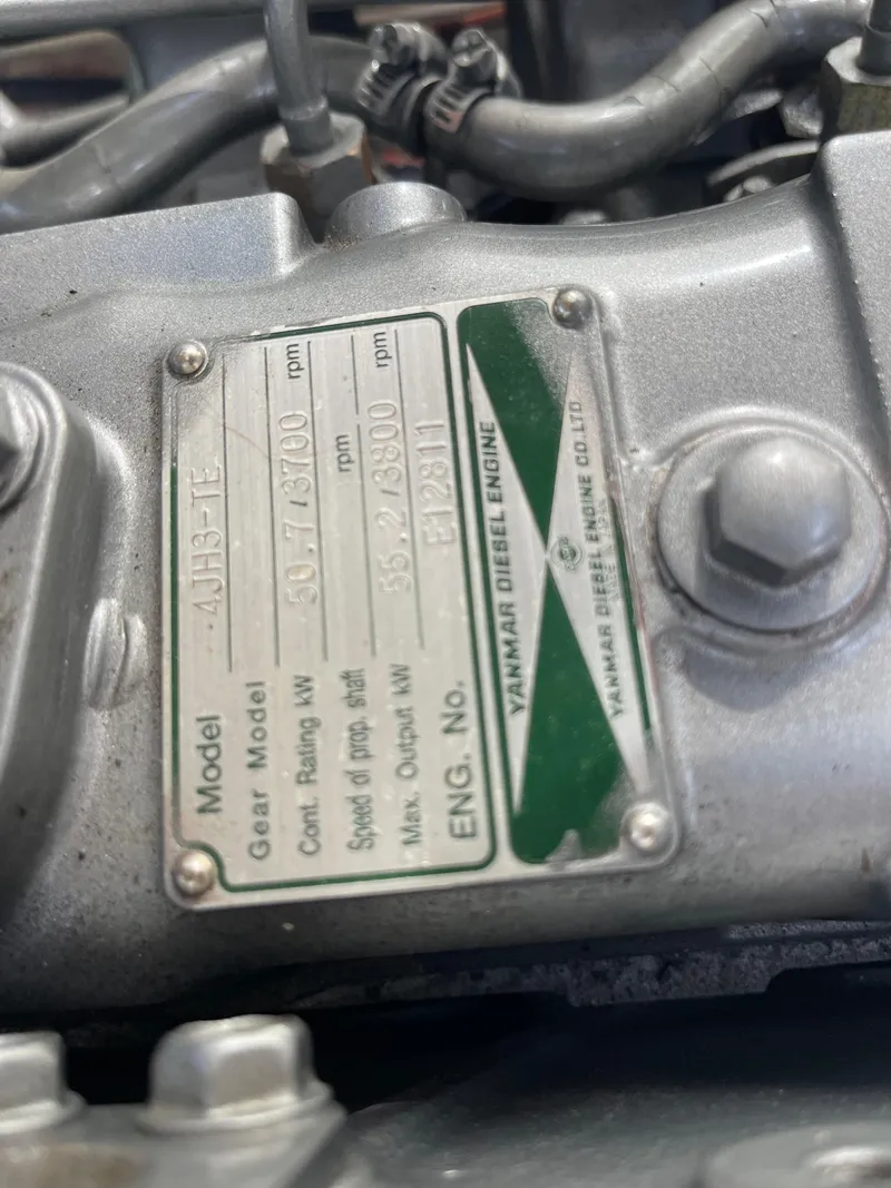 Slide: The Image of Close-up of a Yanmar diesel engine plate on a 2003 Atlas Boat Works Pompano 21. - 47