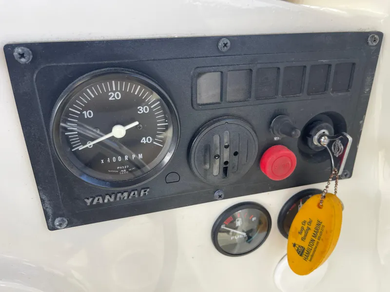 Slide: The Image of Control panel of 2003 Atlas Boat Works Pompano 21 with Yanmar tachometer and ignition key. - 50