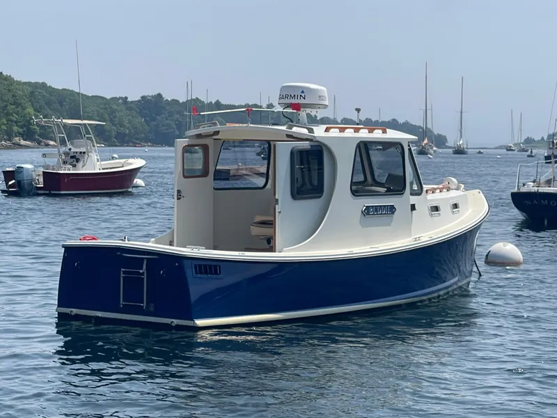 Slide: The Image of 2005 Atlas Boat Works Pompano 21 in a scenic harbor setting. - 6