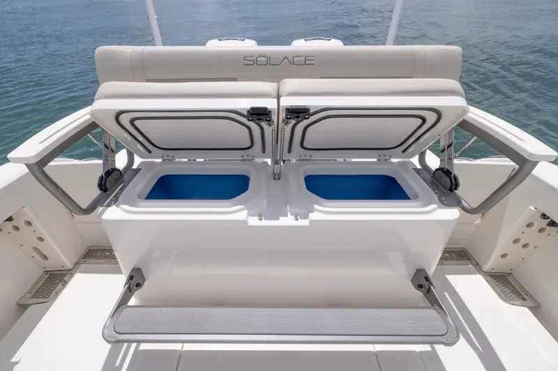 Slide: The Image of 2025 Solace 30 HCS boat with open storage compartments, showcasing sleek design and functionality. - 5