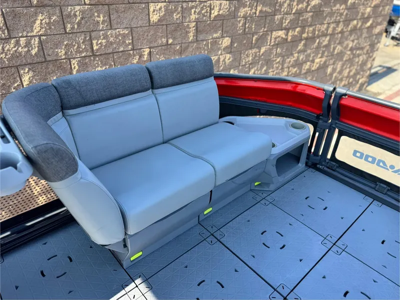 Slide: The Image of 2023 Sea-Doo Switch Cruise 18 interior with gray seating and cup holder. - 10