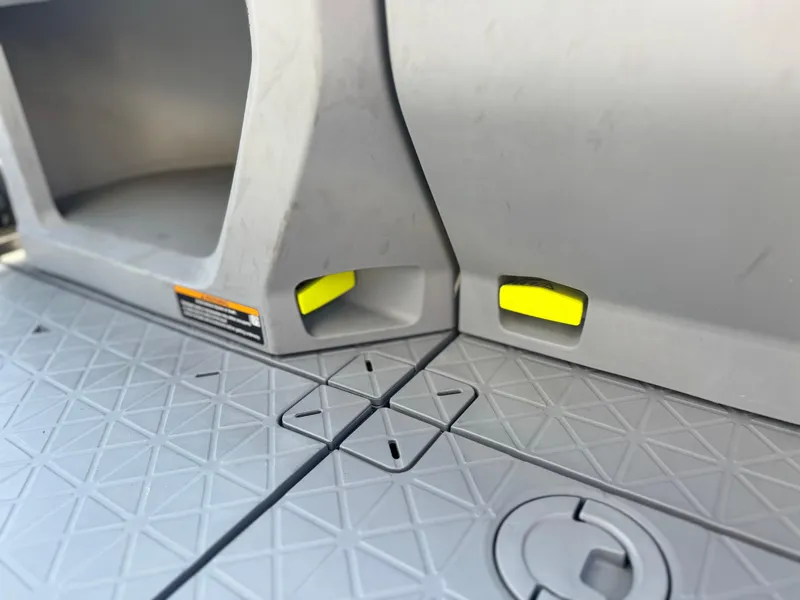 Slide: The Image of 2023 Sea-Doo Switch Cruise 18 interior detail with textured flooring and storage compartment. - 16