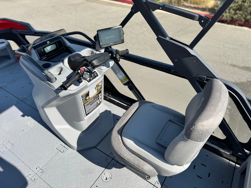 Slide: The Image of 2023 Sea-Doo Switch Cruise 18 cockpit with steering and navigation controls. - 17