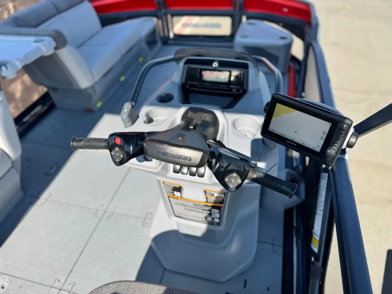 Slide: The Image of 2023 Sea-Doo Switch Cruise 18 dashboard with steering controls and navigation display. - 18