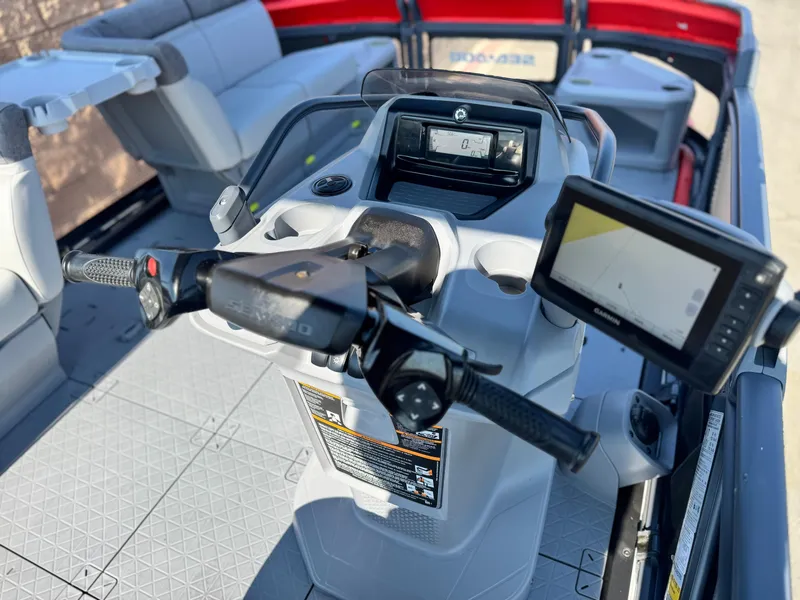 Slide: The Image of 2023 Sea-Doo Switch Cruise 18 dashboard with steering and navigation display. - 19