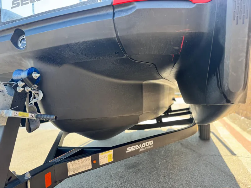 Slide: The Image of 2023 Sea-Doo Switch Cruise 18 on trailer, rear view, showcasing hull design. - 4
