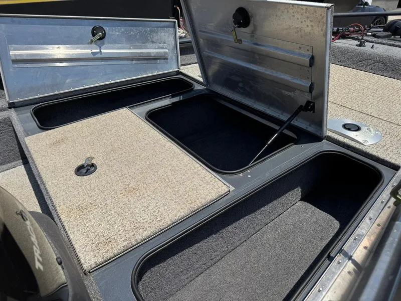 Slide: The Image of 2022 Tracker Pro Team 175 TF boat storage compartments open, showcasing interior space. - 17
