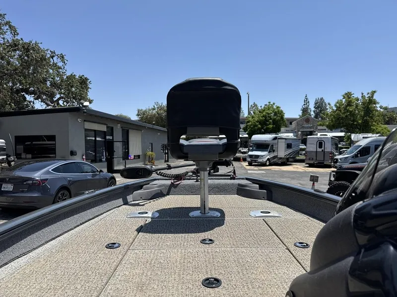 Slide: The Image of 2022 Tracker Pro Team 175 TF boat at dealership, surrounded by cars and RVs. - 18