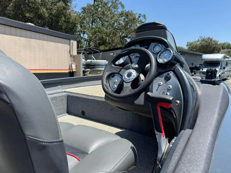 Slide: The Image of 2022 Tracker Pro Team 175 TF boat interior with steering wheel and gauges. - 19