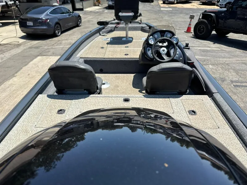 Slide: The Image of 2022 Tracker Pro Team 175 TF boat interior with steering wheel and seats. - 2