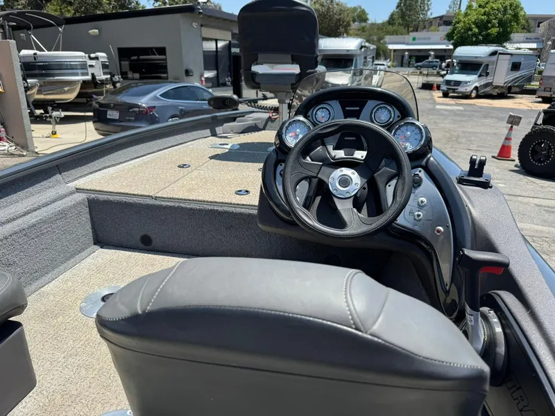 Slide: The Image of 2022 Tracker Pro Team 175 TF boat interior with steering wheel and dashboard controls. - 20