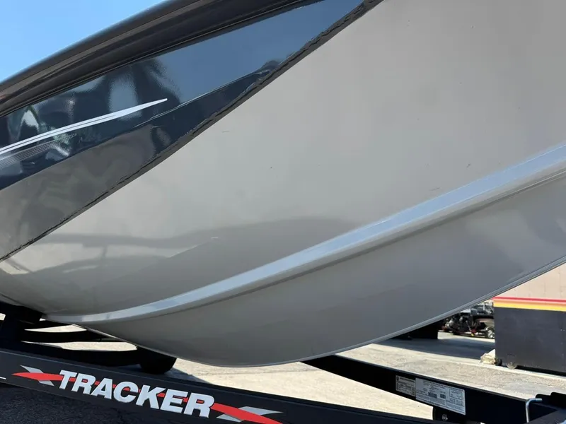 Slide: The Image of 2022 Tracker Pro Team 175 TF boat hull on trailer, close-up view. - 23