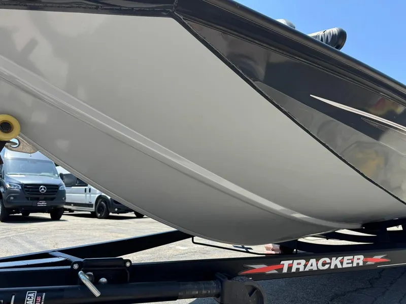 Slide: The Image of 2022 Tracker Pro Team 175 TF boat on trailer, parked in lot. - 25
