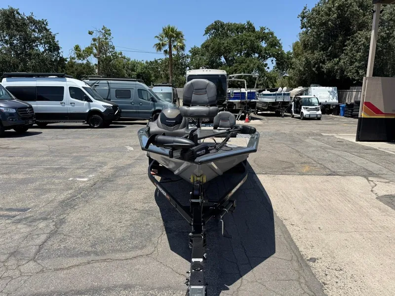 Slide: The Image of 2022 Tracker Pro Team 175 TF boat parked in a lot with surrounding vehicles. - 33