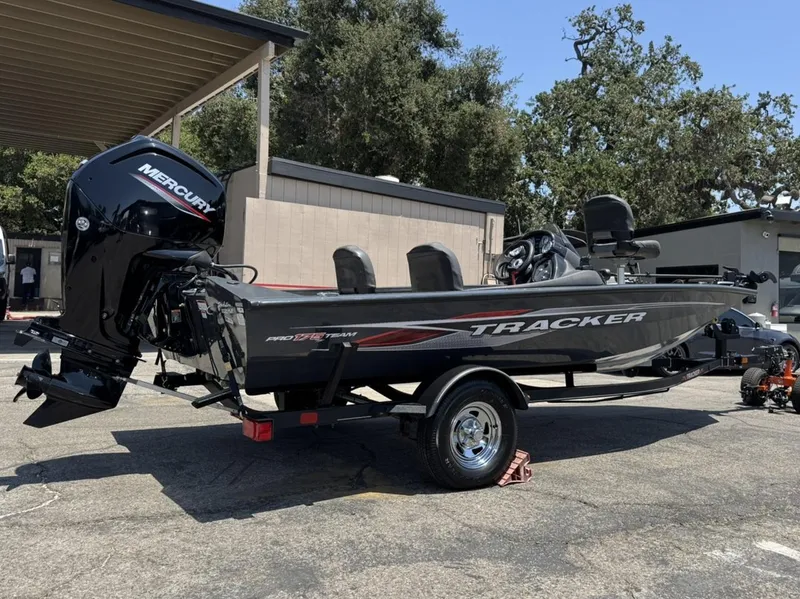 Slide: The Image of 2022 Tracker Pro Team 175 TF boat with Mercury engine, parked outdoors. - 5