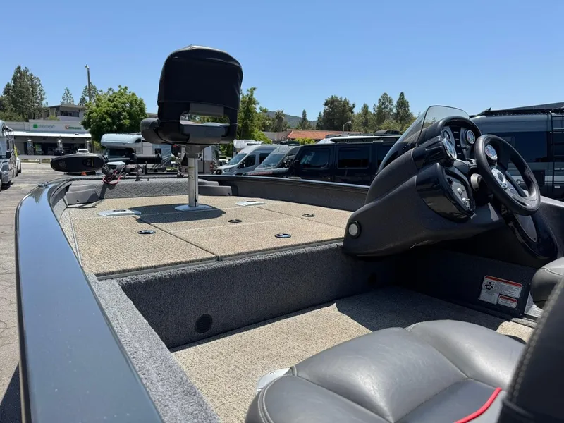 Slide: The Image of 2022 Tracker Pro Team 175 TF boat interior with steering wheel and seating. - 6