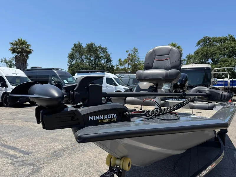 Slide: The Image of 2022 Tracker Pro Team 175 TF boat with Minn Kota PowerDrive, parked outdoors. - 9