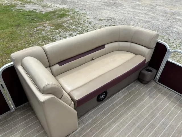 Slide: The Image of Beige seating on 2021 Sweetwater 2186 boat, featuring cup holder and speaker. - 11