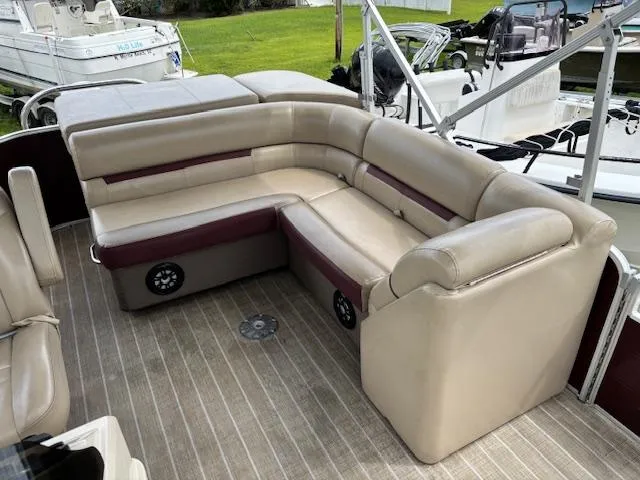 Slide: The Image of Luxurious Sweetwater 2186 pontoon boat seating, 2021 model, with beige and maroon upholstery. - 12