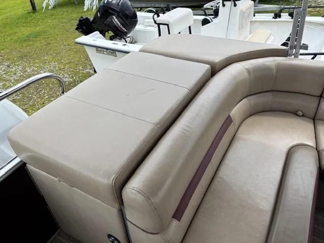 Slide: The Image of Luxurious seating on 2021 Sweetwater 2186 boat, featuring beige upholstery and spacious design. - 13