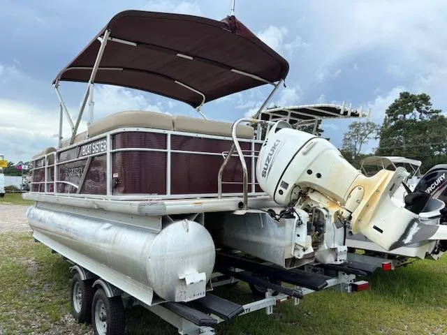 Slide: The Image of Pontoon boat on trailer, Sweetwater 2186 model, 2021, with canopy and outboard motor. - 6
