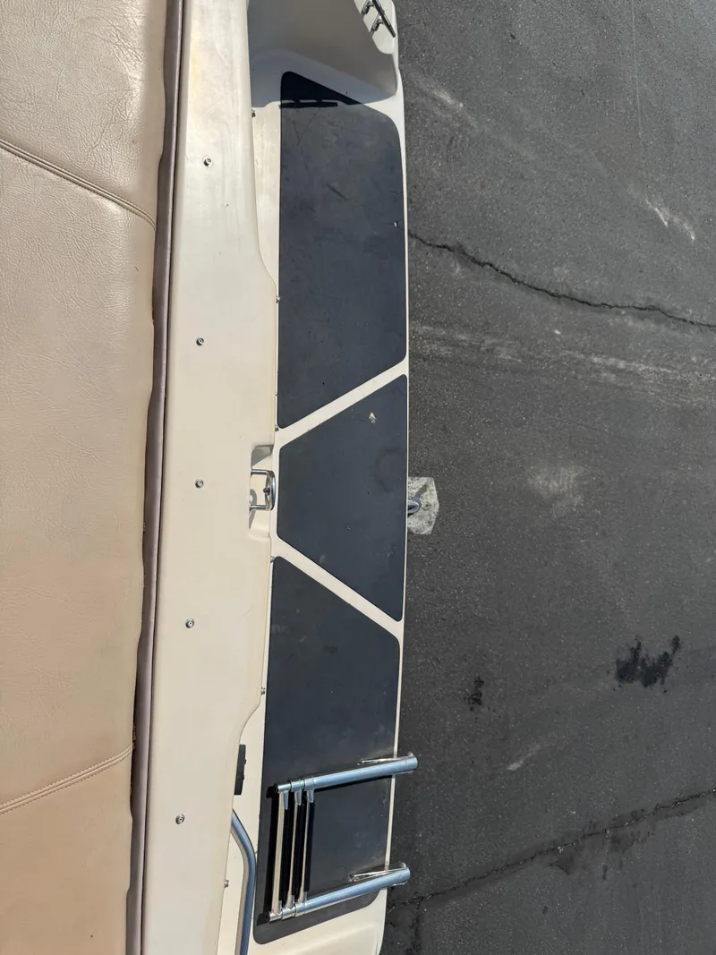 Slide: The Image of 1995 Seaswirl 201 boat interior with ladder and seating area. - 3