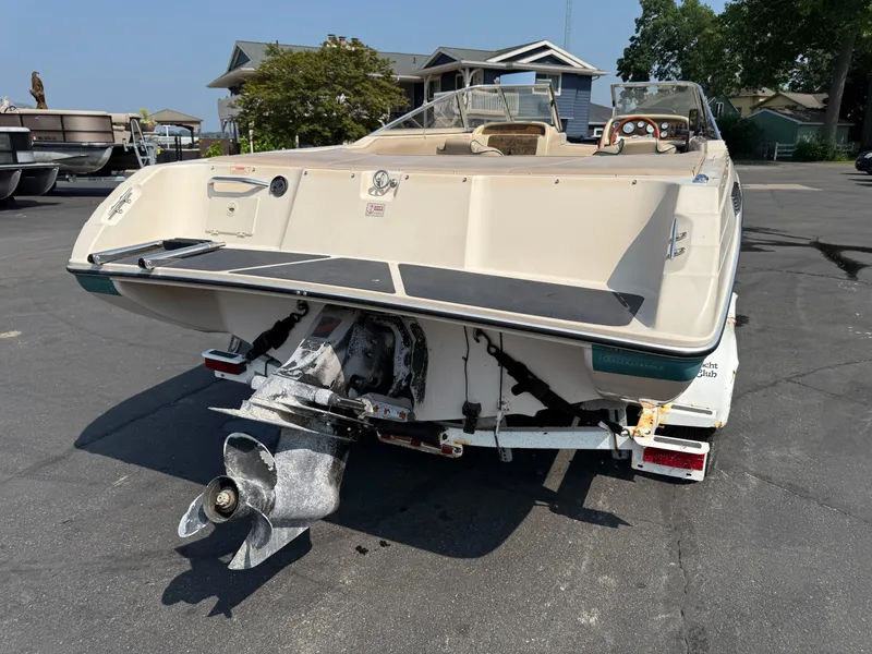 Slide: The Image of 1995 Seaswirl 201 boat on trailer, rear view showing propeller and deck. - 4