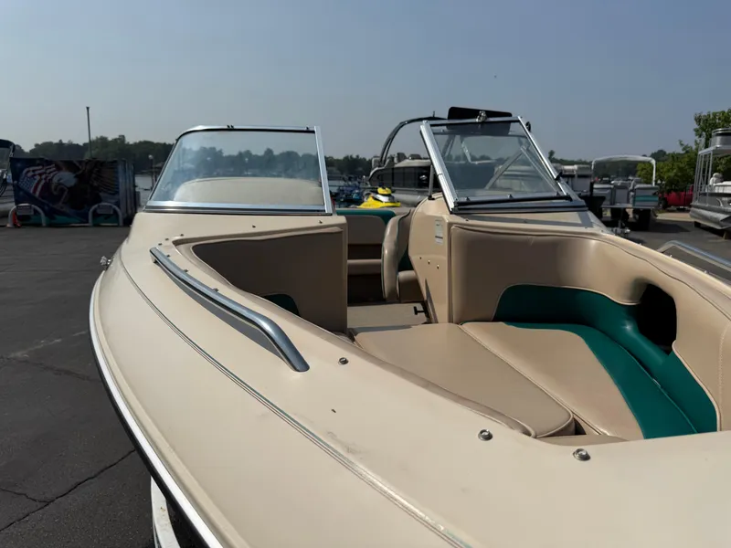 Slide: The Image of 1995 Seaswirl 201 boat with beige and green interior, parked outdoors. - 5