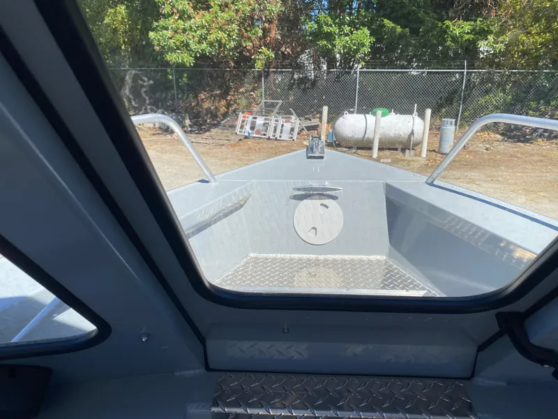 Slide: The Image of Interior view of 2025 Hewescraft 190 Sea Runner HT boat, showcasing bow area. - 5