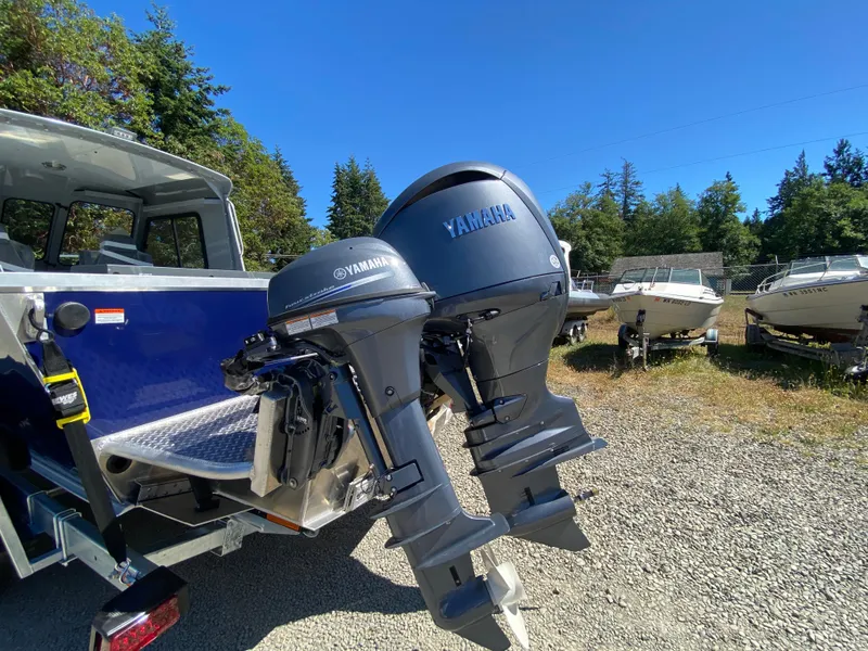 Slide: The Image of 2025 Hewescraft 190 Sea Runner HT with Yamaha outboard motors in a boatyard. - 8