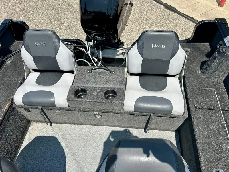 Slide: The Image of 2014 Lund 1625 Rebel XL SS boat interior with dual seats and cup holders. - 12