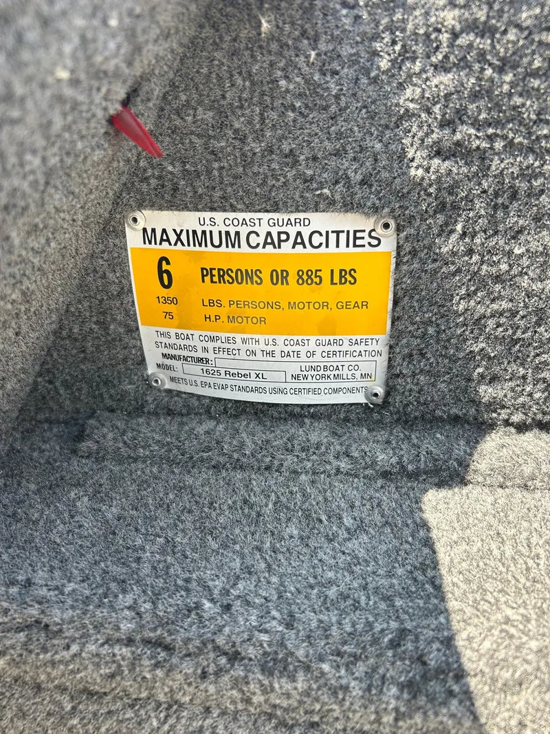 Slide: The Image of 2014 Lund 1625 Rebel XL SS capacity label, 6 persons or 885 lbs, U.S. Coast Guard compliant. - 22