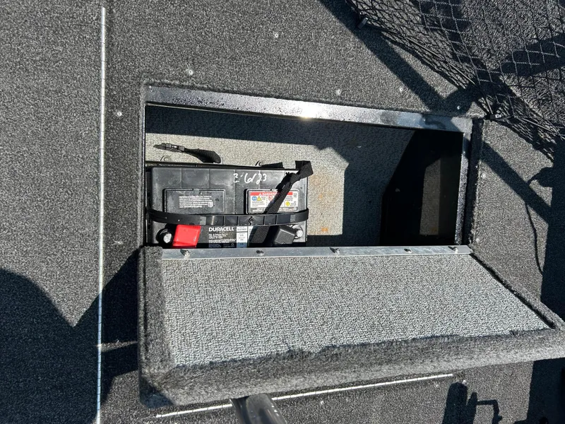 Slide: The Image of 2014 Lund 1625 Rebel XL SS boat battery compartment with Duracell battery. - 27
