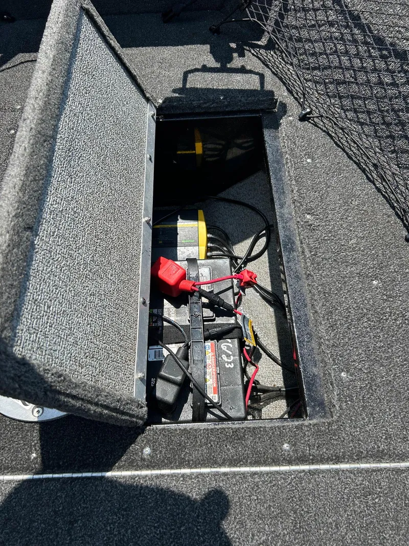 Slide: The Image of 2014 Lund 1625 Rebel XL SS boat battery compartment with wiring. - 29