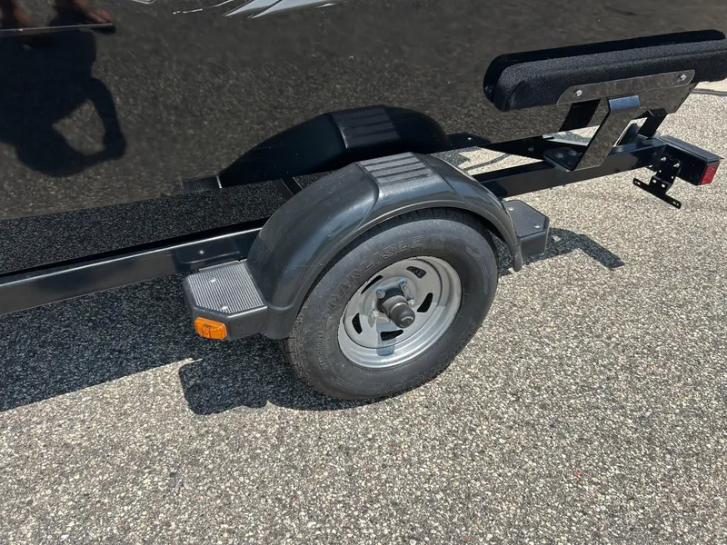 Slide: The Image of Trailer wheel of 2014 Lund 1625 Rebel XL SS on asphalt surface. - 35