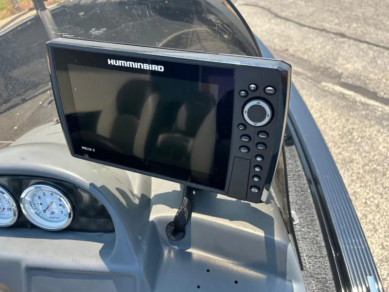 Slide: The Image of Humminbird Helix 5 fish finder on 2014 Lund 1625 Rebel XL SS boat dashboard. - 4