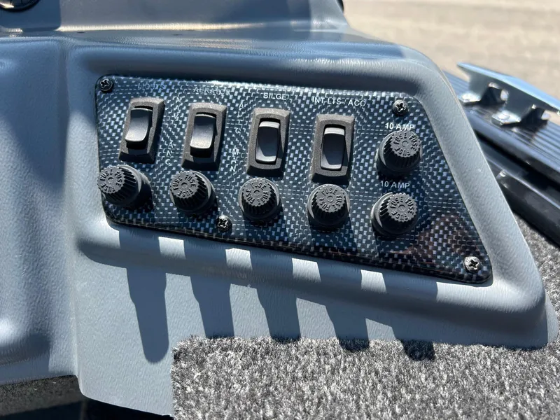 Slide: The Image of Control panel of 2014 Lund 1625 Rebel XL SS boat with switches and fuses. - 5