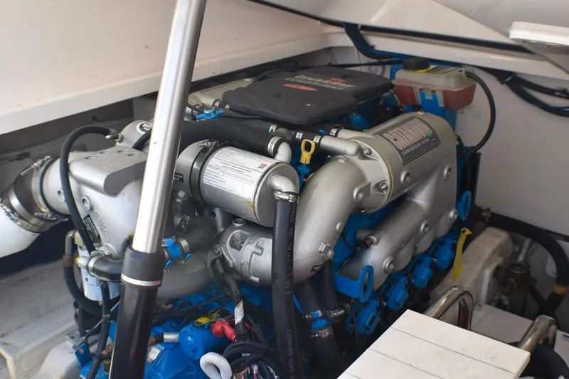 Slide: The Image of Engine compartment of a 2013 Tiara Yachts 3100 Open, showcasing detailed mechanical components. - 10