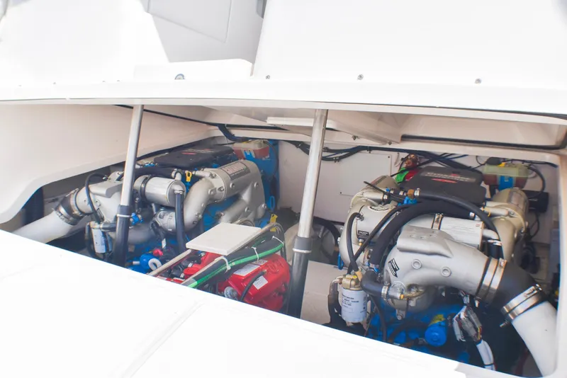 Slide: The Image of Engine compartment of 2013 Tiara Yachts 3100 Open, showcasing dual engines and mechanical components. - 11