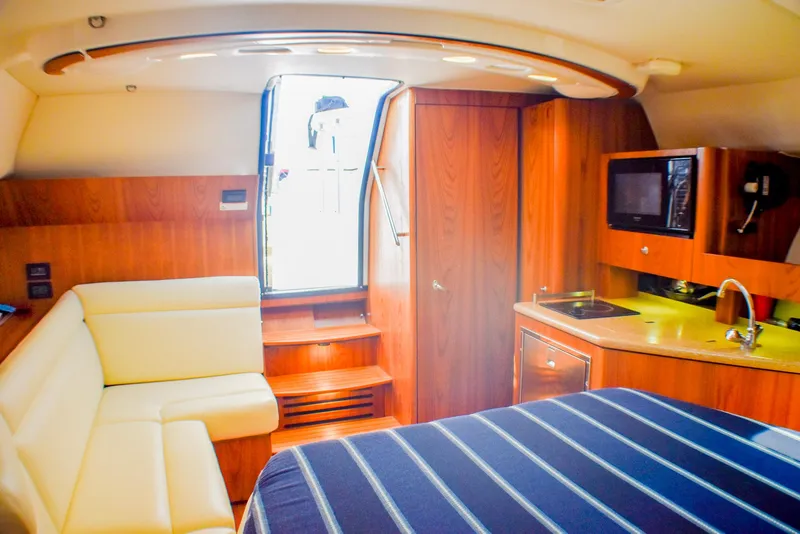 Slide: The Image of Luxurious interior of 2013 Tiara Yachts 3100 Open with kitchenette and seating area. - 28