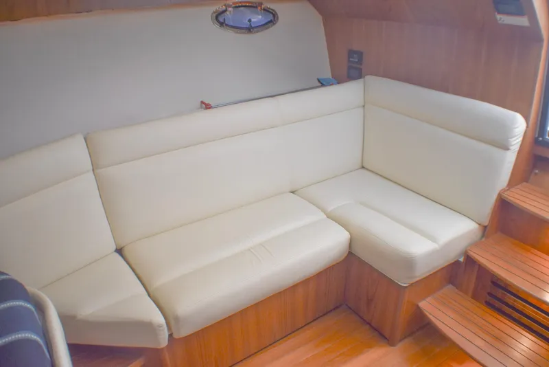 Slide: The Image of Luxurious interior of 2013 Tiara Yachts 3100 Open with cream leather seating. - 33