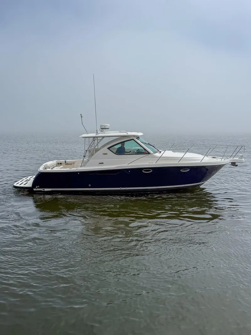 Slide: The Image of 2013 Tiara Yachts 3100 Open on calm water, side view. - 4