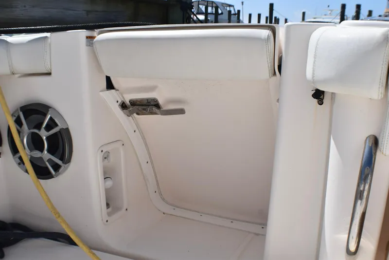 Slide: The Image of 2013 Tiara Yachts 3100 Open interior with speaker and cushioned seating. - 6