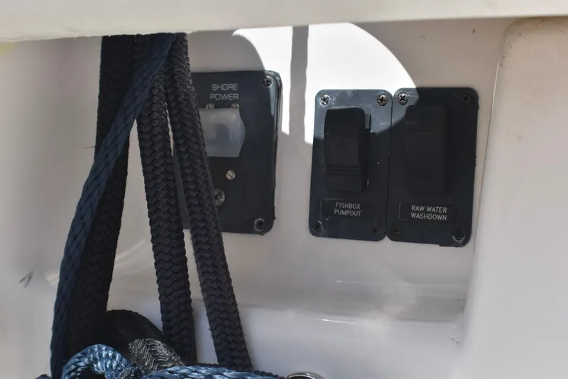 Slide: The Image of Control panel on 2013 Tiara Yachts 3100 Open, featuring shore power and pump switches. - 7