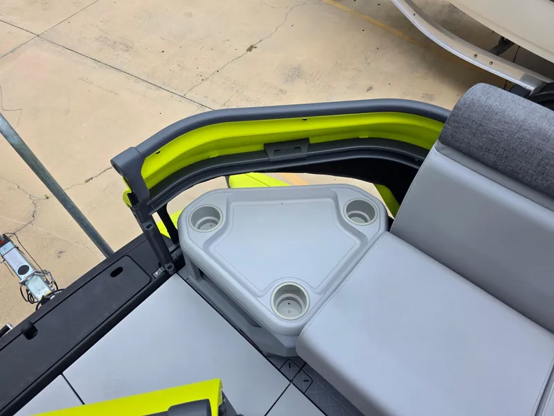 Slide: The Image of 2024 Sea-Doo Switch boat interior with seating and cup holders, featuring modern design elements. - 11