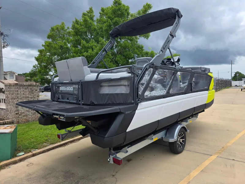 Slide: The Image of 2024 Sea-Doo Switch boat on trailer, featuring sleek design and modern features, parked outdoors. - 3