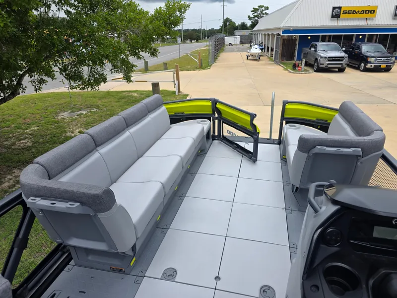Slide: The Image of 2024 Sea-Doo Switch boat interior with gray seating and open deck layout. - 7